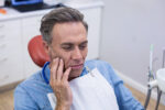 Unhappy man having a toothache